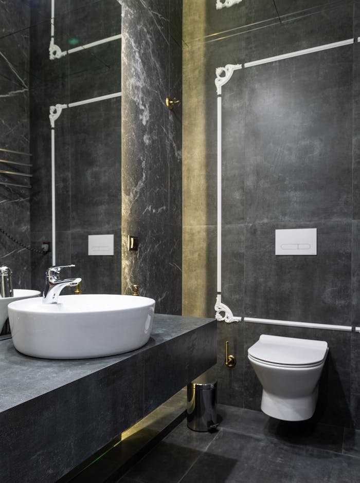 creative-02 Elegant modern bathroom featuring marble walls and contemporary sink.