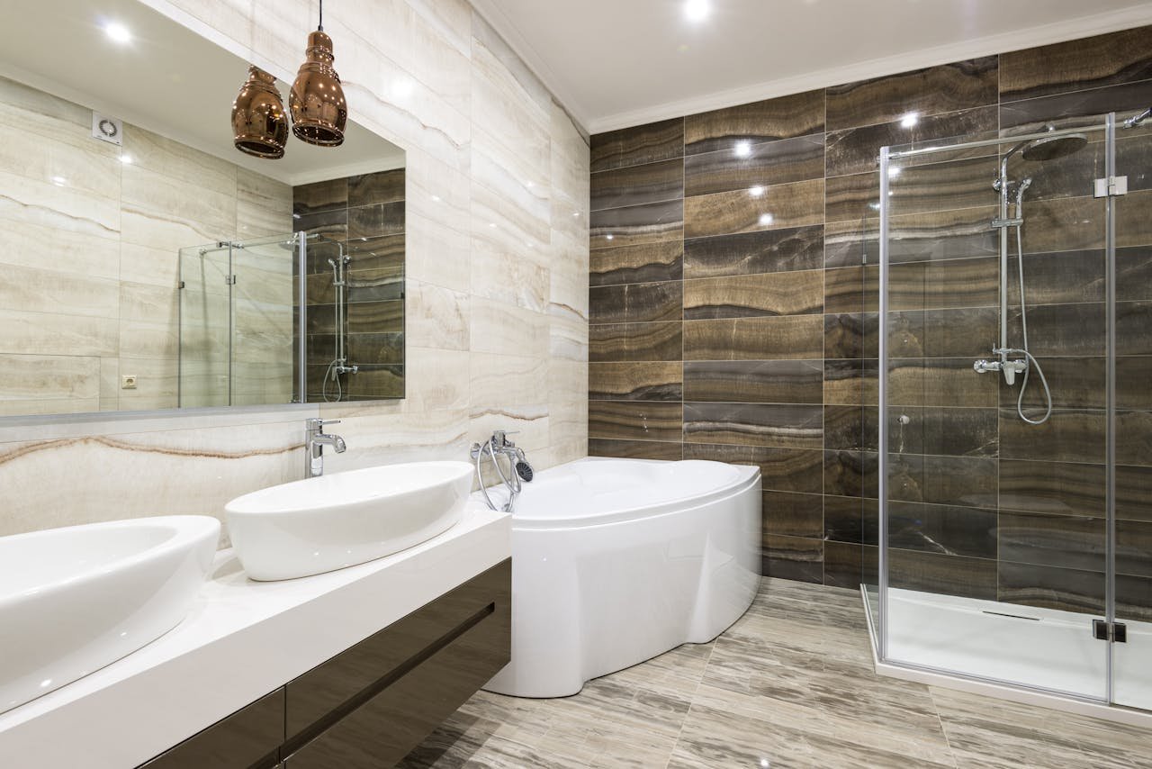 creative Contemporary bathroom design featuring sleek white fixtures and stylish tiles.